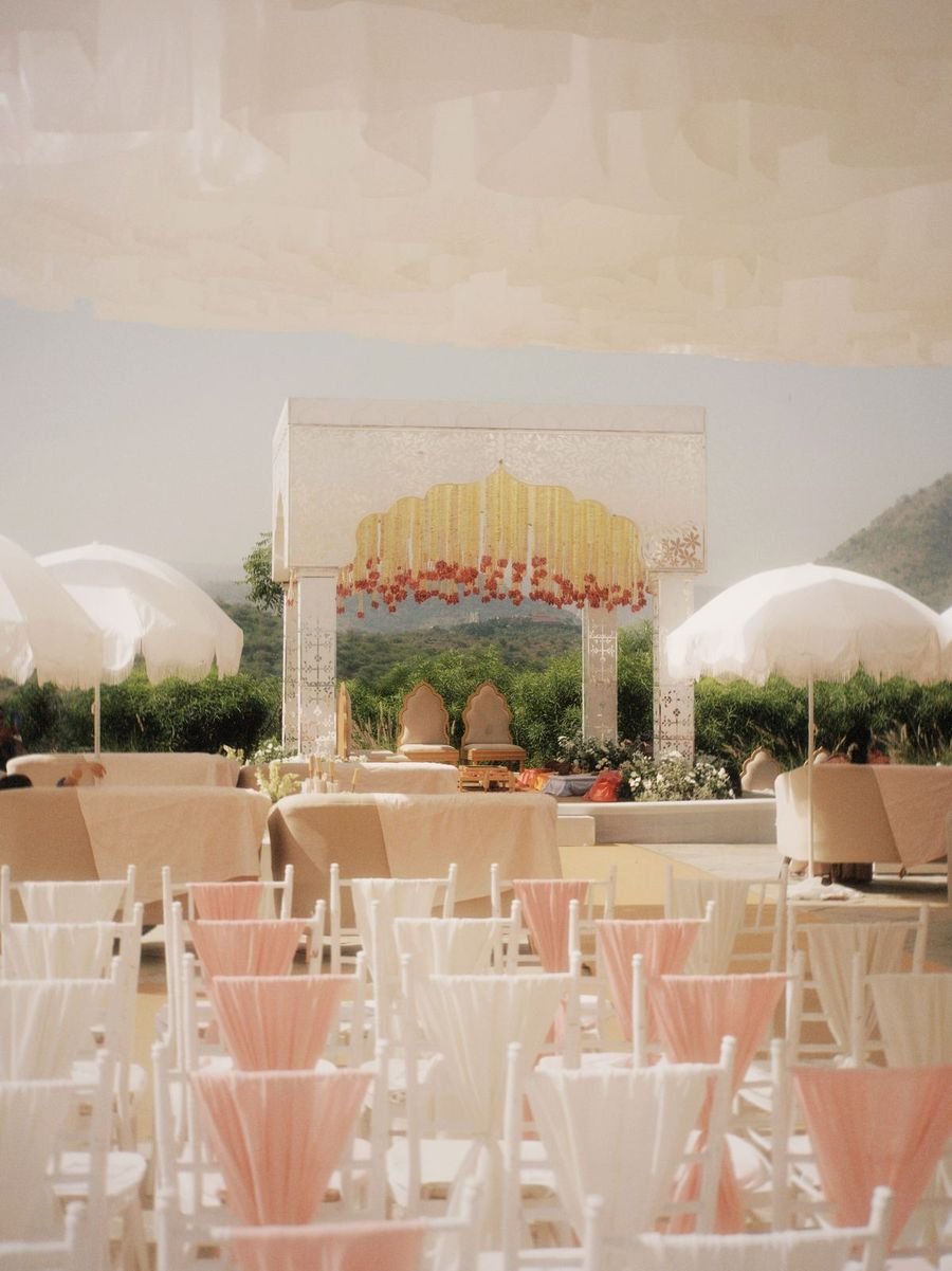Outdoor wedding seating with a floral mandap