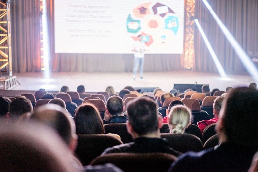 Speaker on stage at a conference