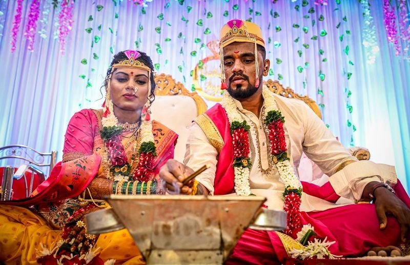 Couple seated at the mandap for the pheras