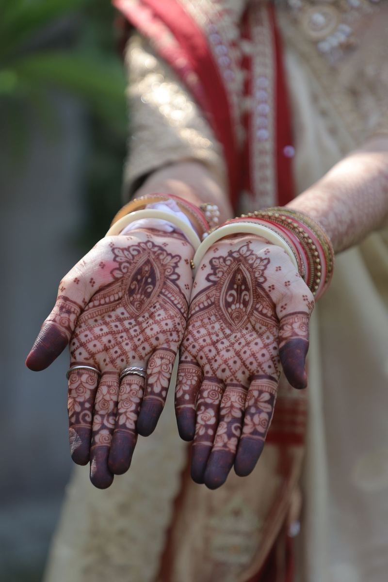 Bride's hands with fresh mehendi